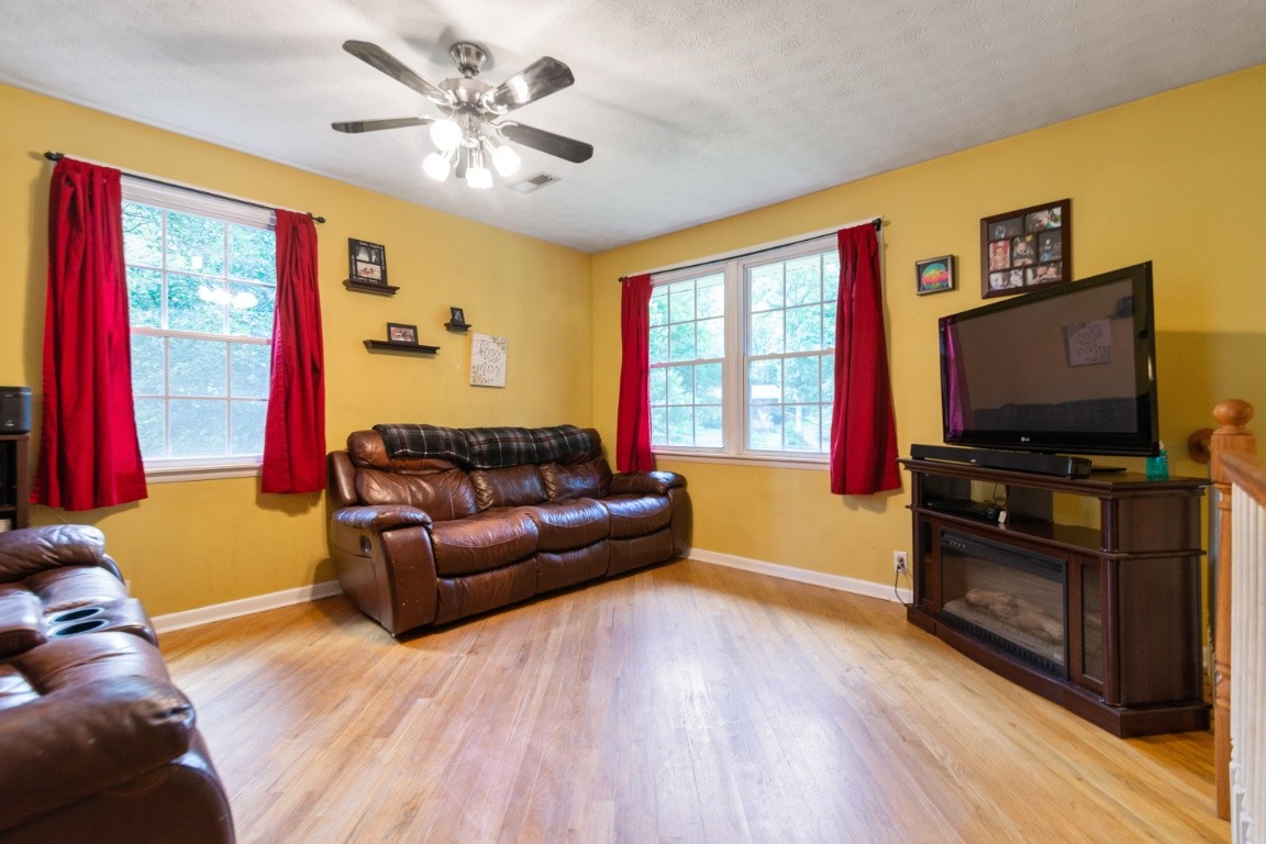 739 Thompson Road Pegram, TN 37143 - Photo 2 of 35 a living room with furniture and a flat screen tv