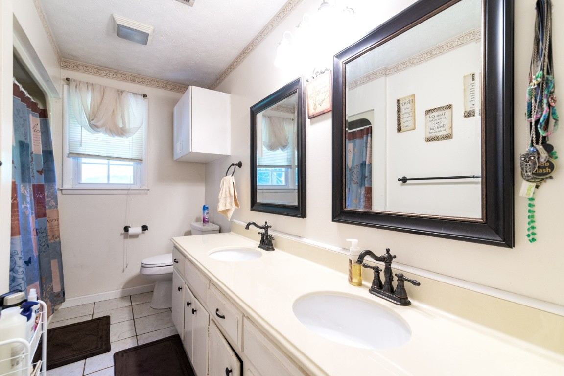 739 Thompson Road Pegram, TN 37143 - Photo 25 of 35 a bathroom with 2 sink and a mirror