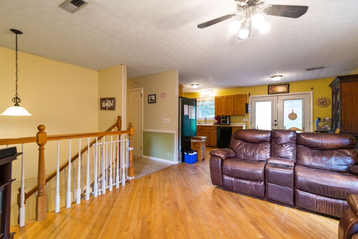 739 Thompson Road Pegram, TN 37143 - Photo 3 of 35 a living room with furniture and a wooden floor