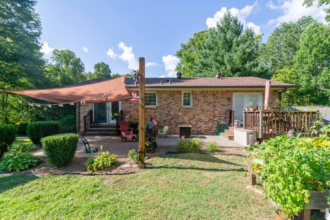 739 Thompson Road Pegram, TN 37143 - Photo 31 of 35 a view of a house with a yard and sitting area