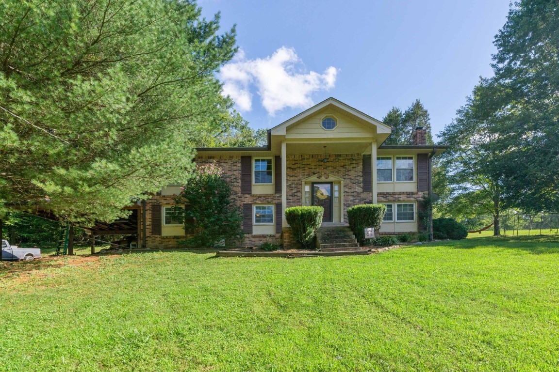 739 Thompson Road Pegram, TN 37143 - Photo 35 of 35 a front view of house with yard outdoor seating and green space