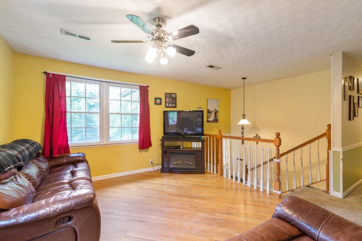 739 Thompson Road Pegram, TN 37143 - Photo 4 of 35 a living room with furniture and a flat screen tv