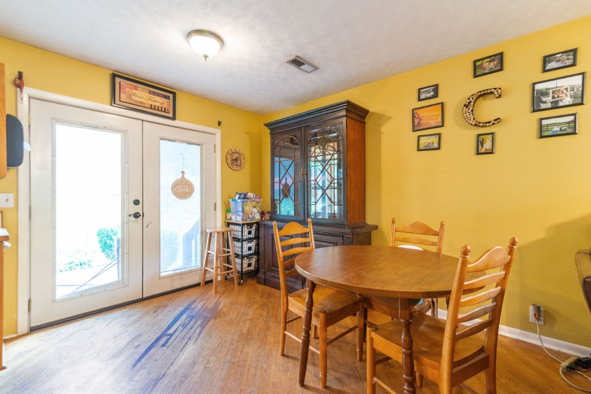 739 Thompson Road Pegram, TN 37143 - Photo 5 of 35 a dining room with furniture and wooden floor