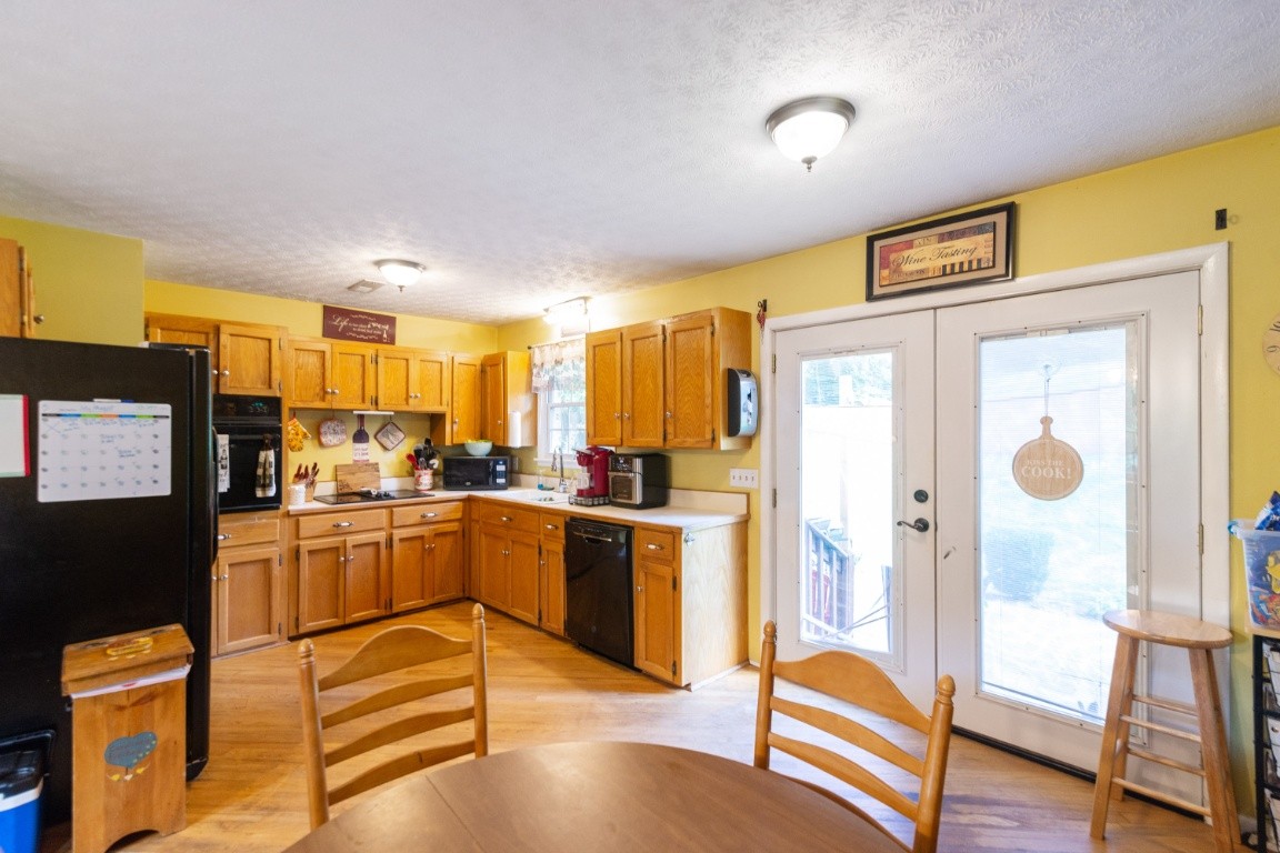 739 Thompson Road Pegram, TN 37143 - Photo 6 of 35 a kitchen with stainless steel appliances granite countertop a refrigerator and microwave