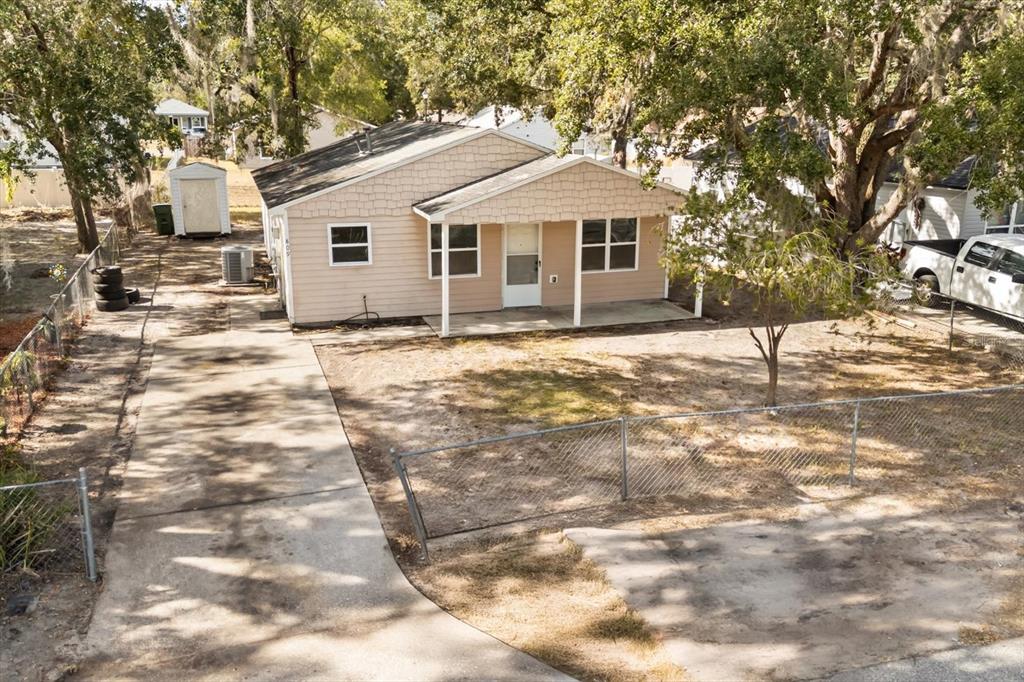 809 Talladega Street Leesburg, FL 34748 - Photo 12 of 13 a front view of a house with a yard