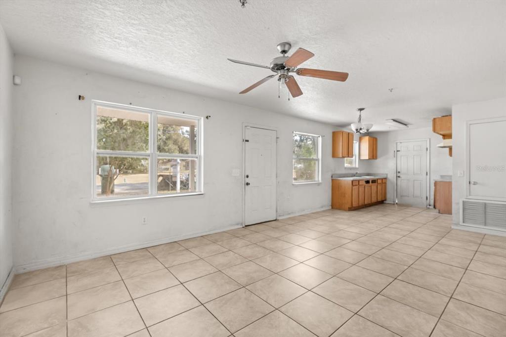 809 Talladega Street Leesburg, FL 34748 - Photo 6 of 13 a view of an empty room and window