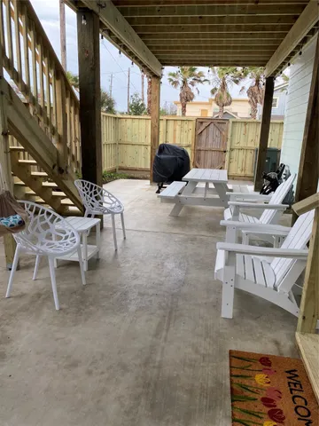 a view of a chairs and table in the patio