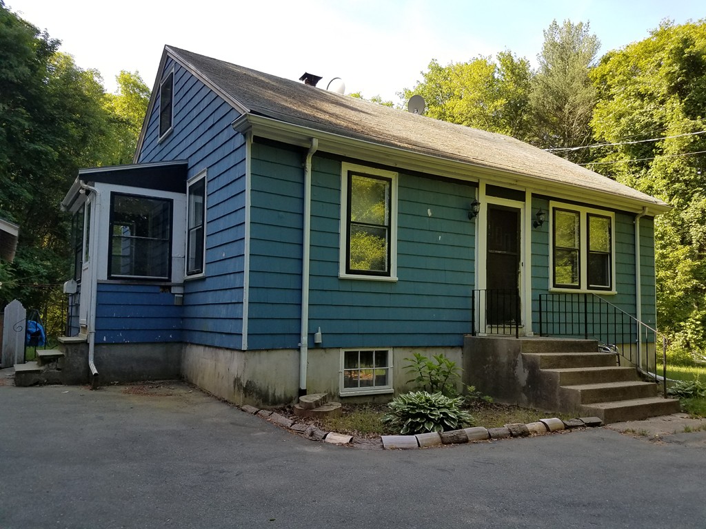 166 Hathaway Road Acushnet, MA 02743 - Photo 2 of 14 a front view of a house with garage