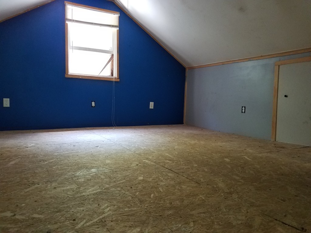 166 Hathaway Road Acushnet, MA 02743 - Photo 7 of 14 a view of an empty room with a window