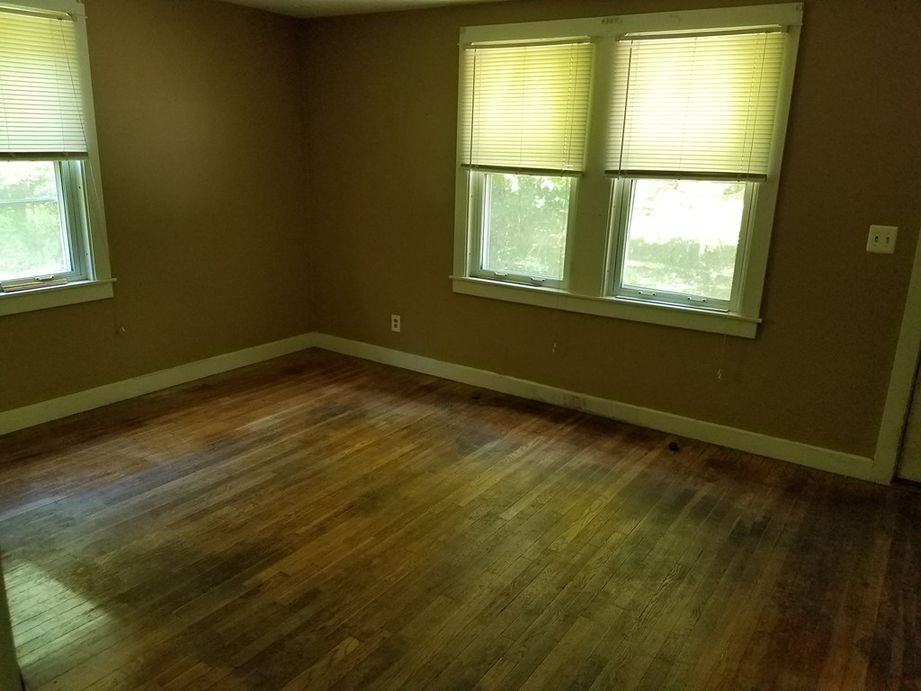 166 Hathaway Road Acushnet, MA 02743 - Photo 8 of 14 a view of an empty room with a window