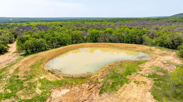 a view of yard with swimming pool