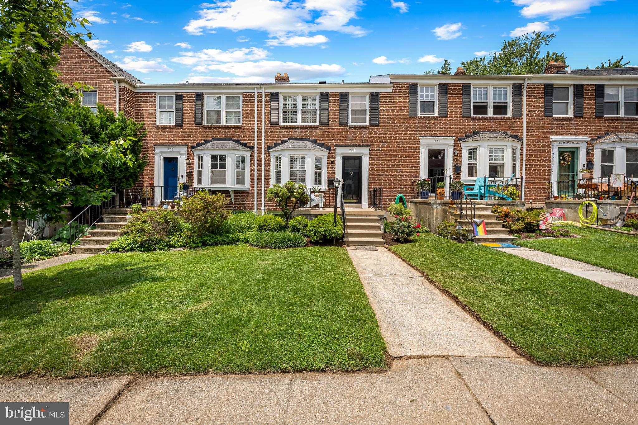 210 Stanmore Road Baltimore, MD 21212 - Photo 1 of 39 a front view of a house with a yard