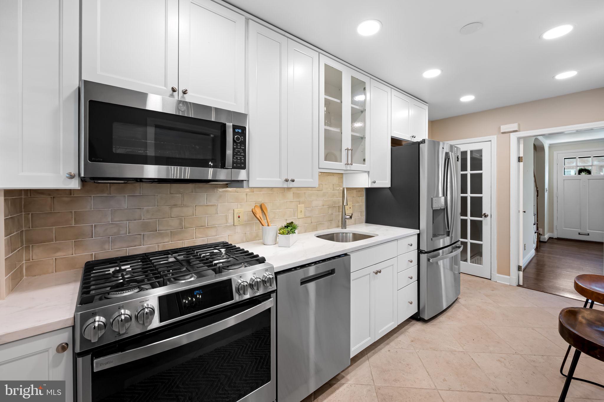210 Stanmore Road Baltimore, MD 21212 - Photo 14 of 39 a kitchen with a stove and a microwave