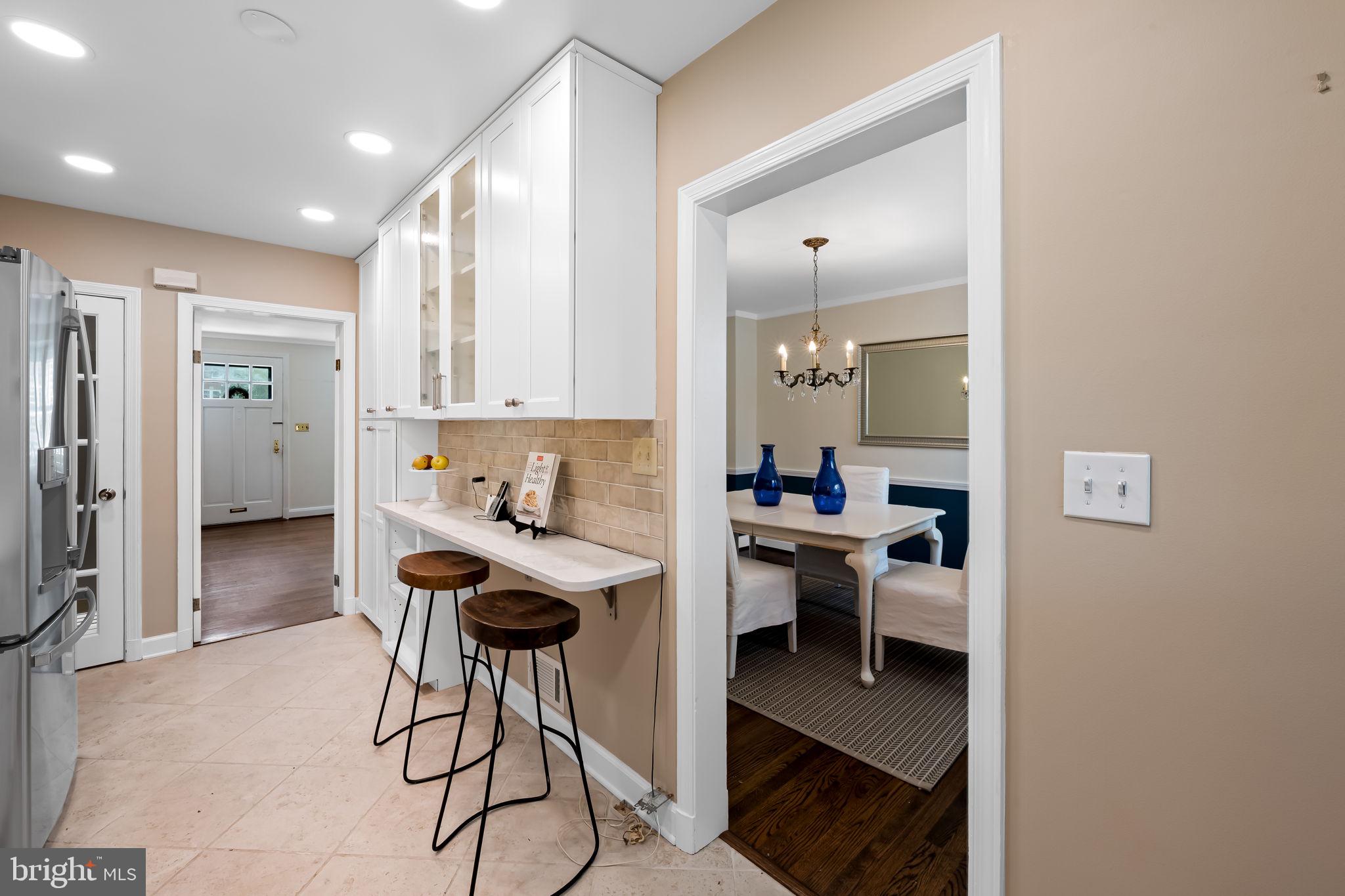 210 Stanmore Road Baltimore, MD 21212 - Photo 15 of 39 a view of a kitchen with kitchen island dining table and stainless steel appliances