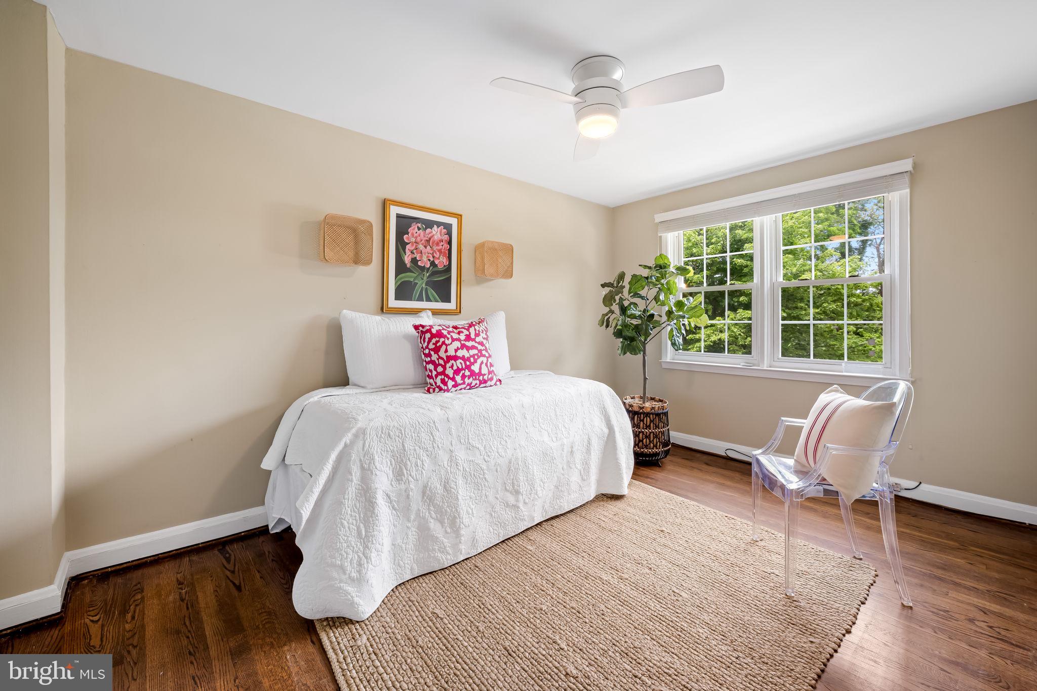 210 Stanmore Road Baltimore, MD 21212 - Photo 18 of 39 a bedroom with a bed and wooden floor