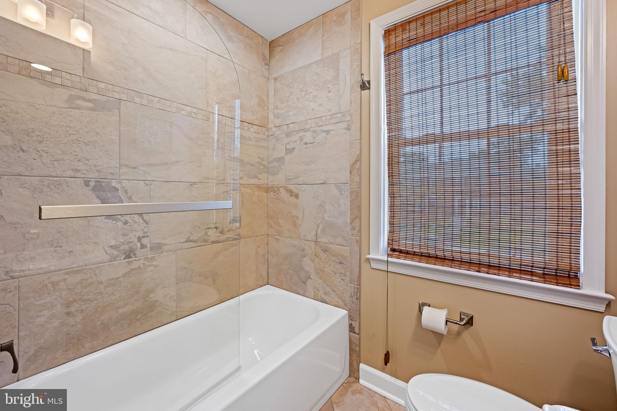 210 Stanmore Road Baltimore, MD 21212 - Photo 25 of 39 a bathroom with a sink a toilet and bathtub