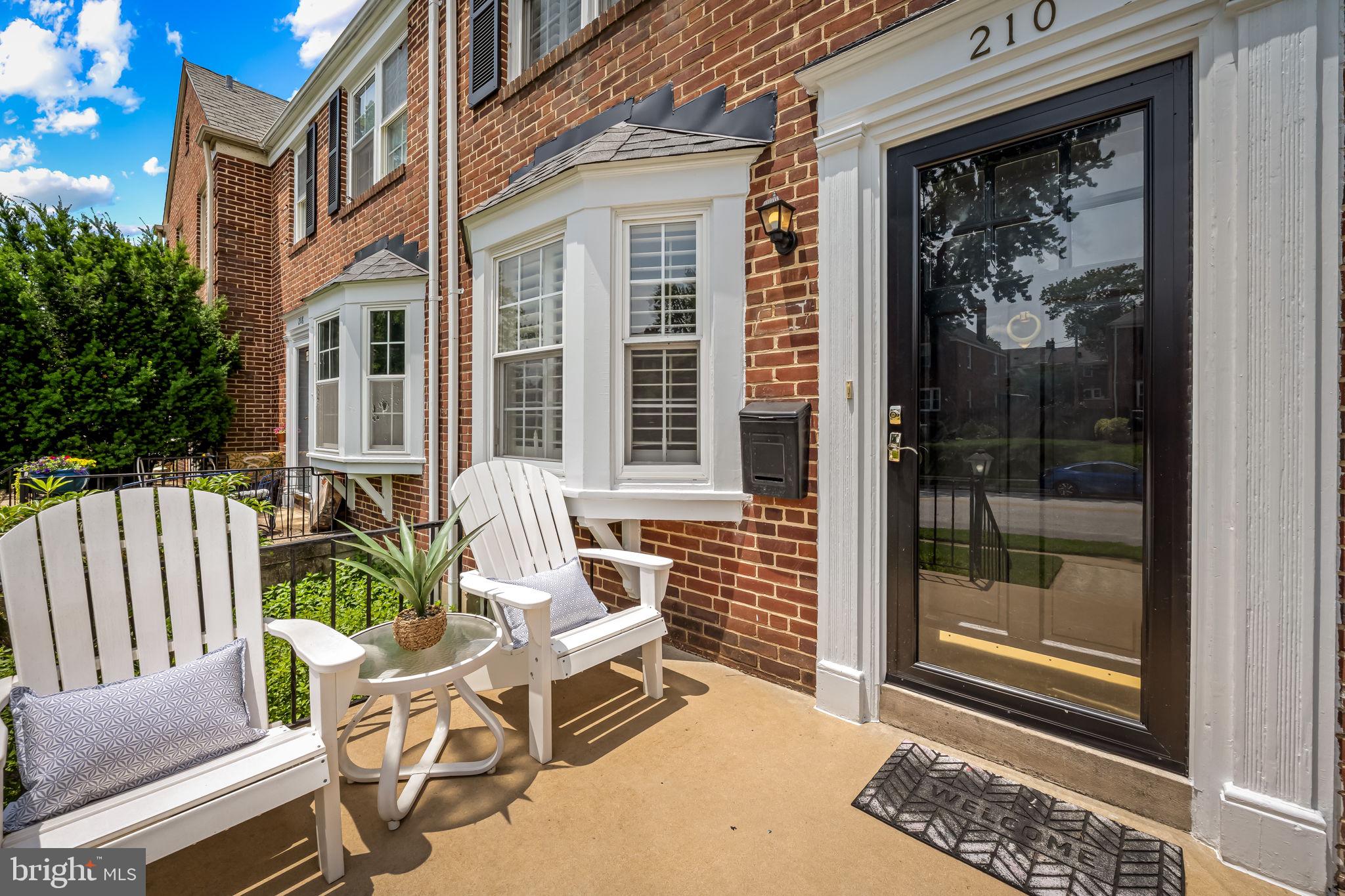 210 Stanmore Road Baltimore, MD 21212 - Photo 5 of 39 a view of a chair and table in the back yard of the house
