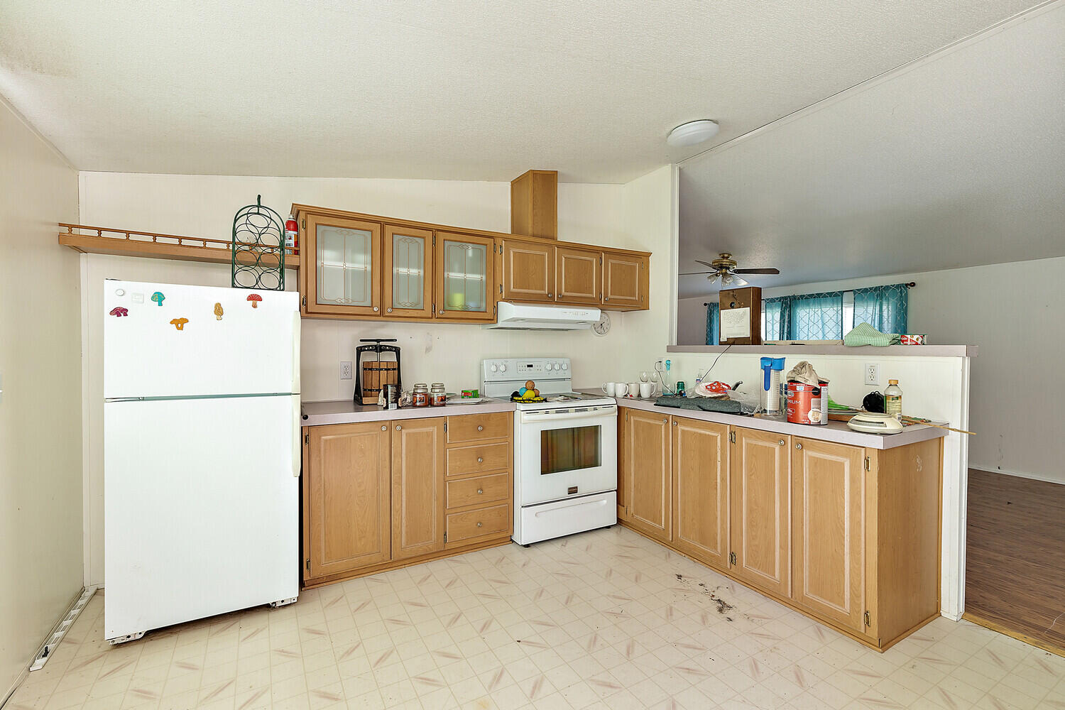 10710 Meadows Road White City, OR 97503 - Photo 31 of 46 a kitchen with sink a refrigerator and cabinets