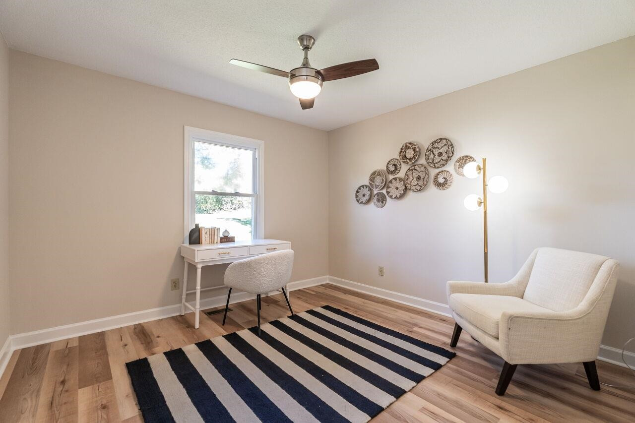 3300 Blue Ridge Road Raleigh, NC 27612 - Photo 18 of 25 a work room with wooden floor and a window