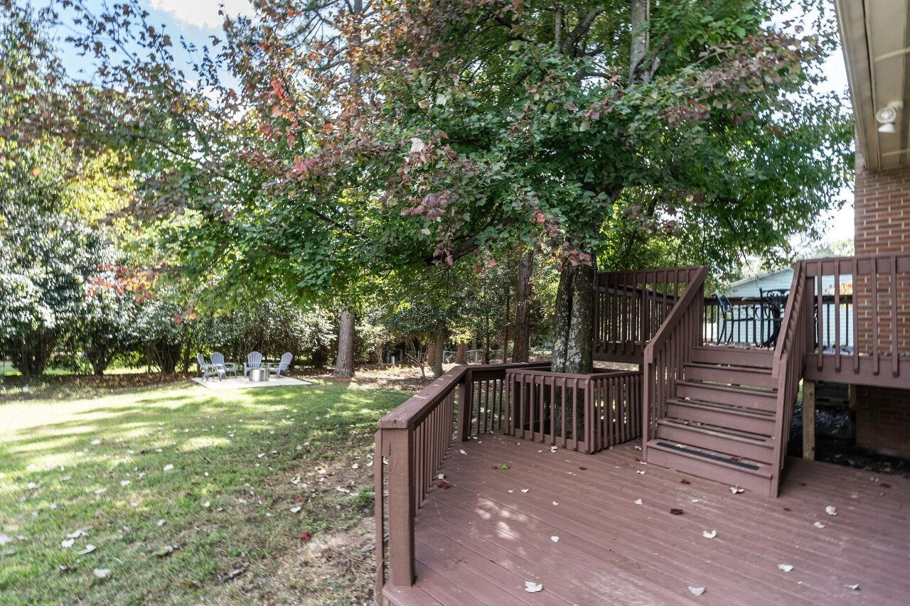 3300 Blue Ridge Road Raleigh, NC 27612 - Photo 22 of 25 a view of house with backyard and sitting area