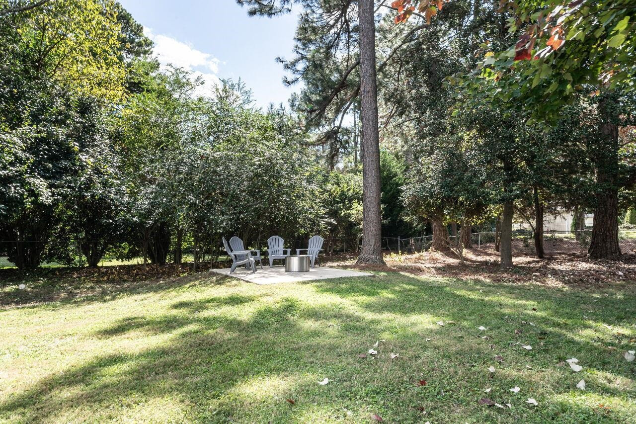 3300 Blue Ridge Road Raleigh, NC 27612 - Photo 24 of 25 a view of a yard with a tree