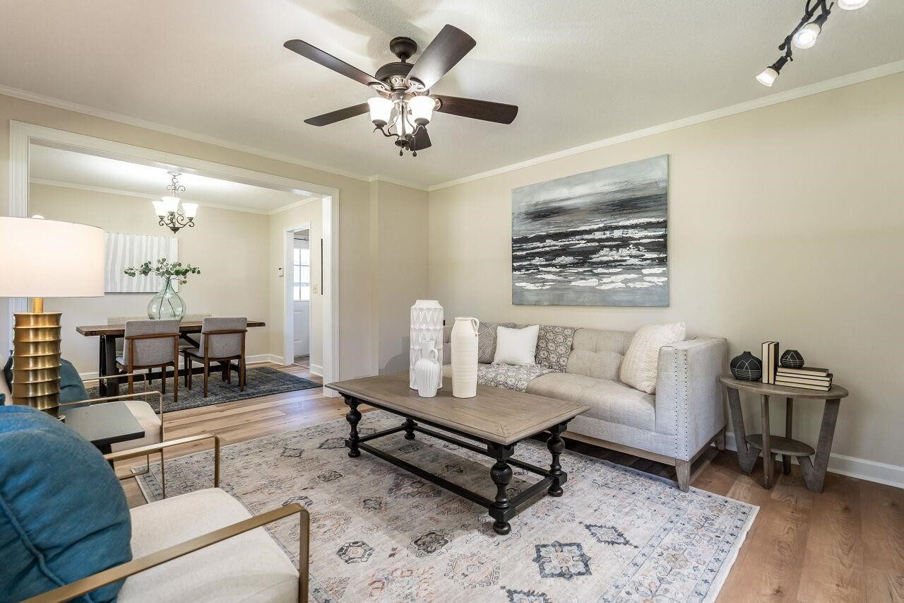 3300 Blue Ridge Road Raleigh, NC 27612 - Photo 4 of 25 a living room with furniture and wooden floor