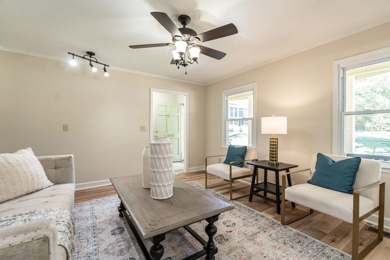 3300 Blue Ridge Road Raleigh, NC 27612 - Photo 6 of 25 a living room with furniture and wooden floor