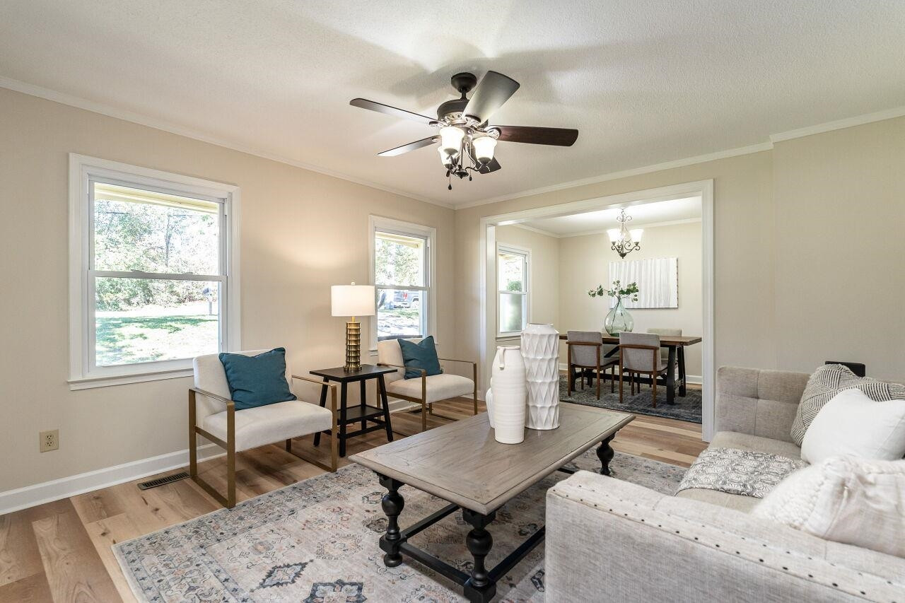 3300 Blue Ridge Road Raleigh, NC 27612 - Photo 7 of 25 a living room with furniture and a window