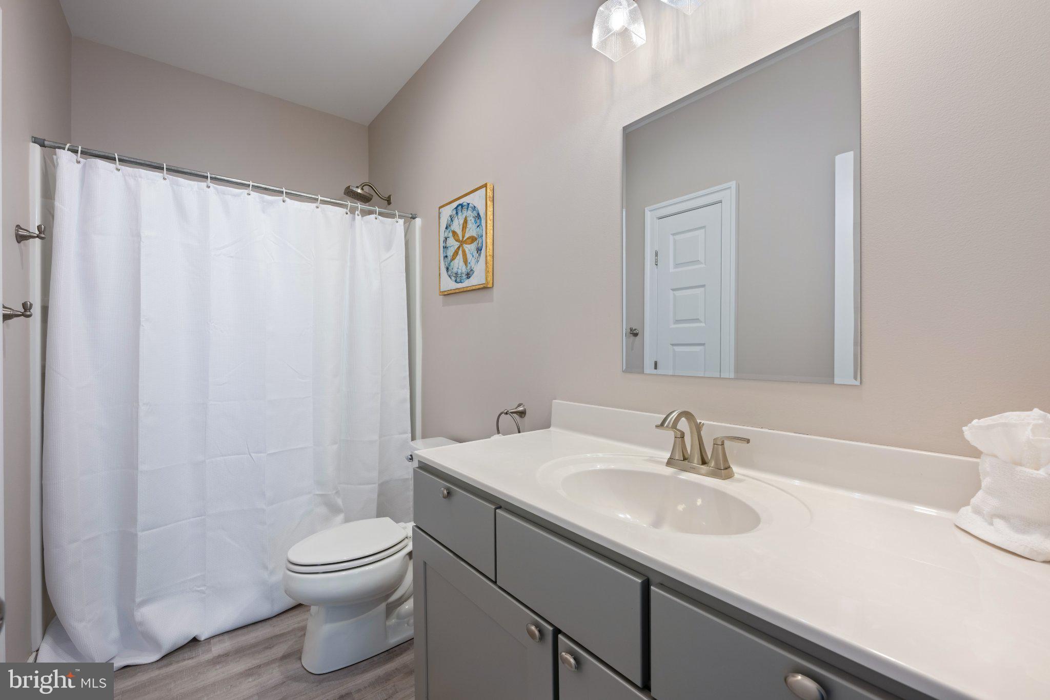 402 Salt Pond Road Bethany Beach, DE 19930 - Photo 35 of 55 Modern bathroom with serene tones.