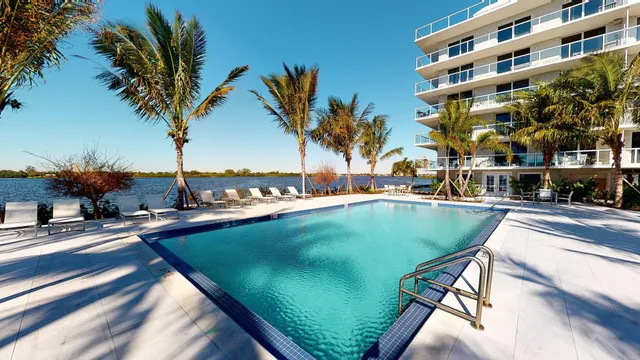 a view of a swimming pool with a lounge chairs