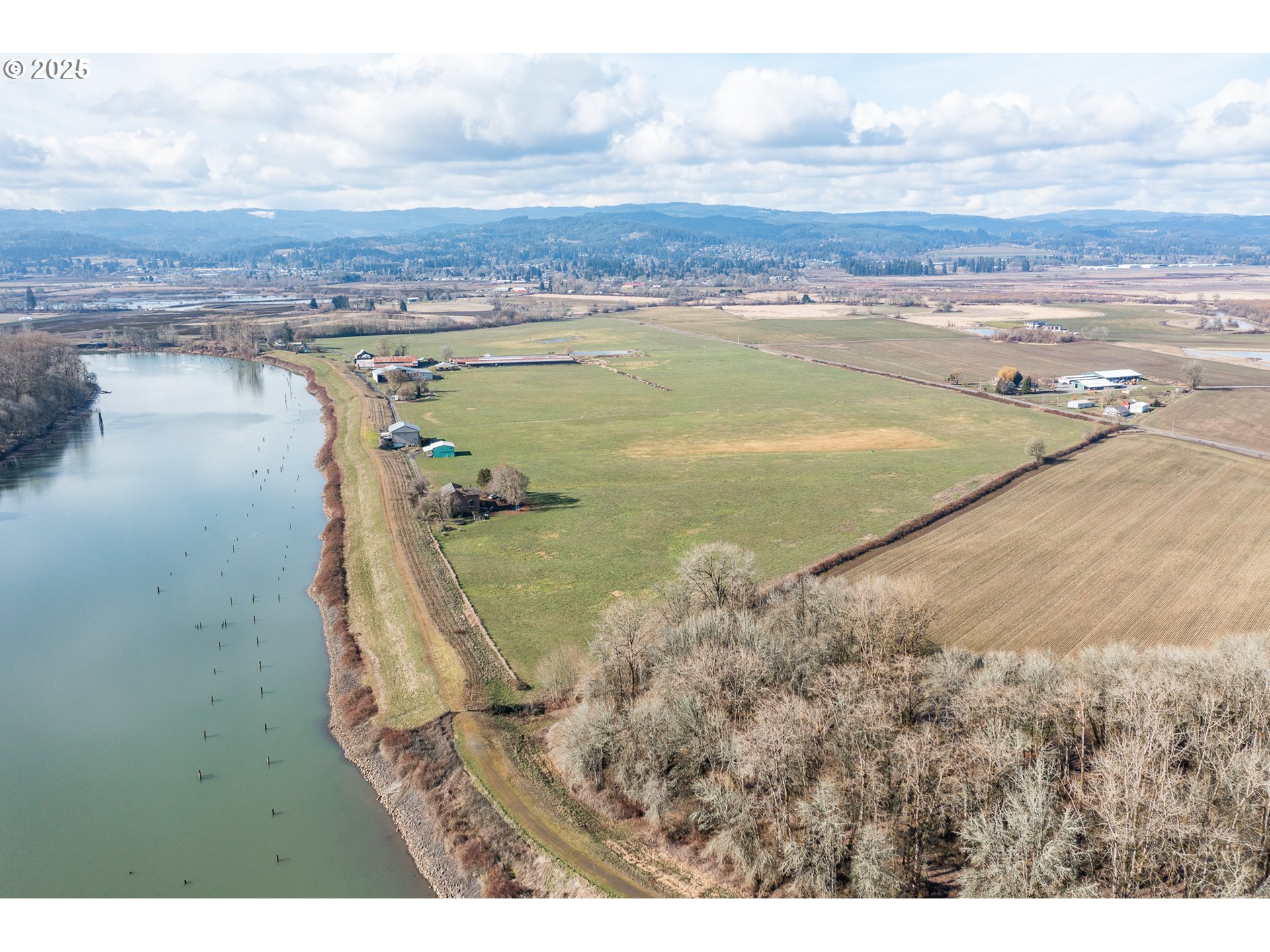 35308 Riverside Lane Scappoose, OR 97056 - Photo 1 of 48 a view of a lake with a mountain
