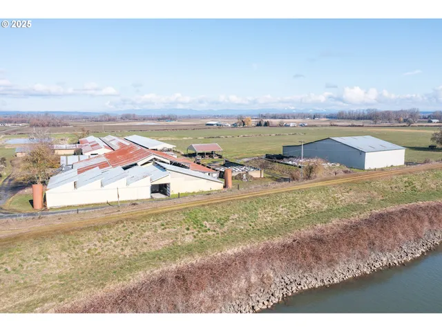 a swimming pool with outdoor seating and yard