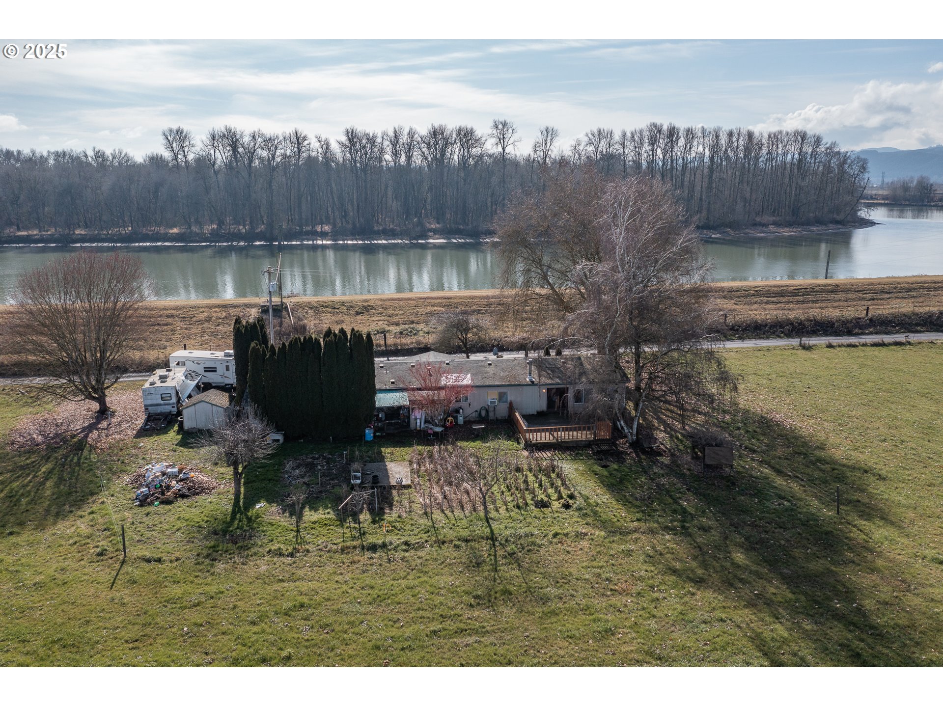 35308 Riverside Lane Scappoose, OR 97056 - Photo 16 of 48 a view of a lake with a mountain in the background