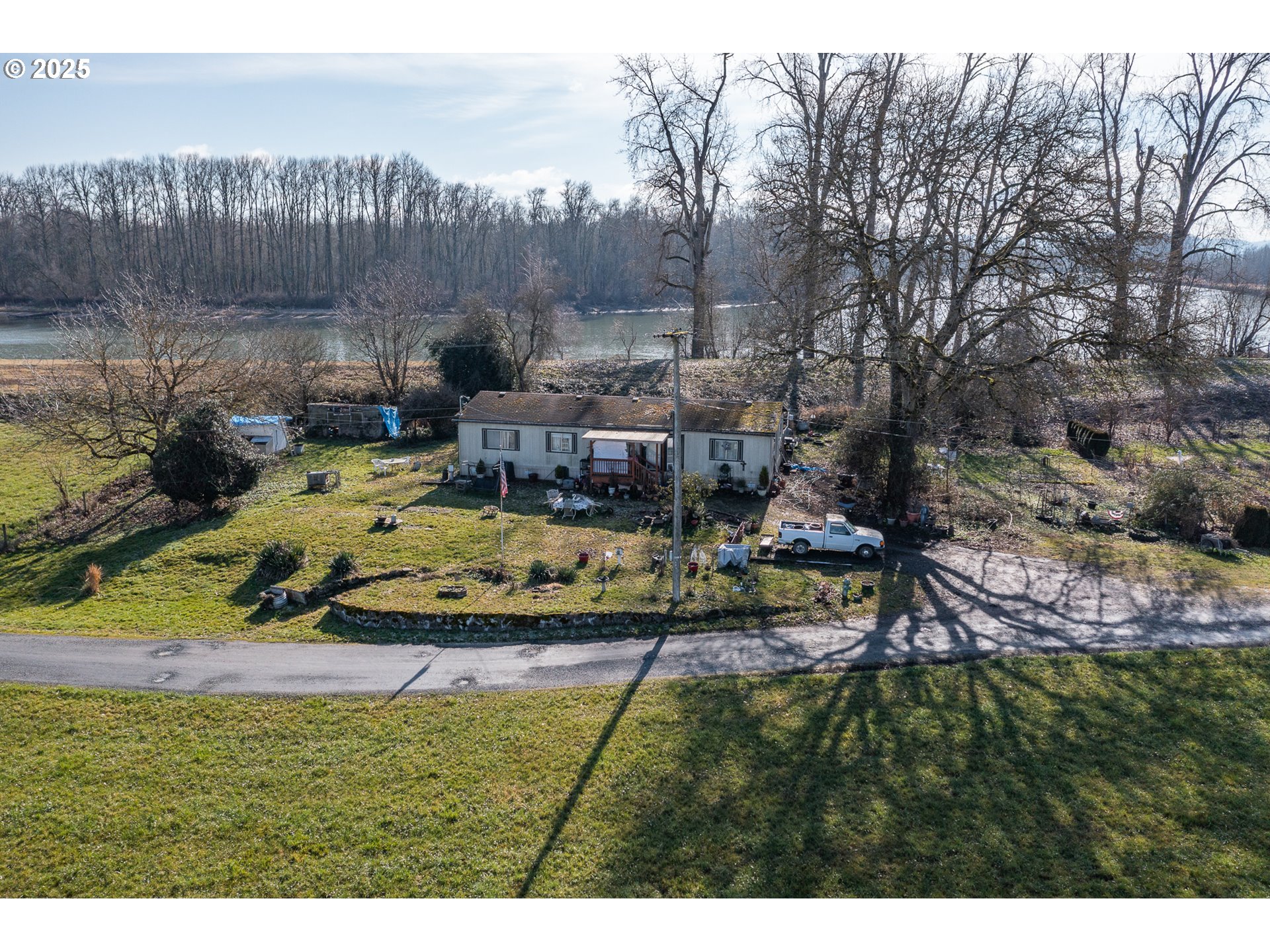 35308 Riverside Lane Scappoose, OR 97056 - Photo 17 of 48 a view of a house with a yard