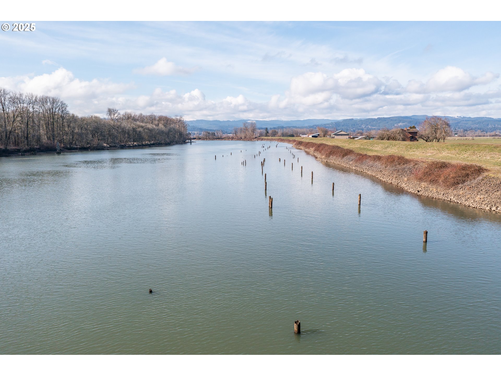35308 Riverside Lane Scappoose, OR 97056 - Photo 6 of 48 a view of lake with mountain in the background