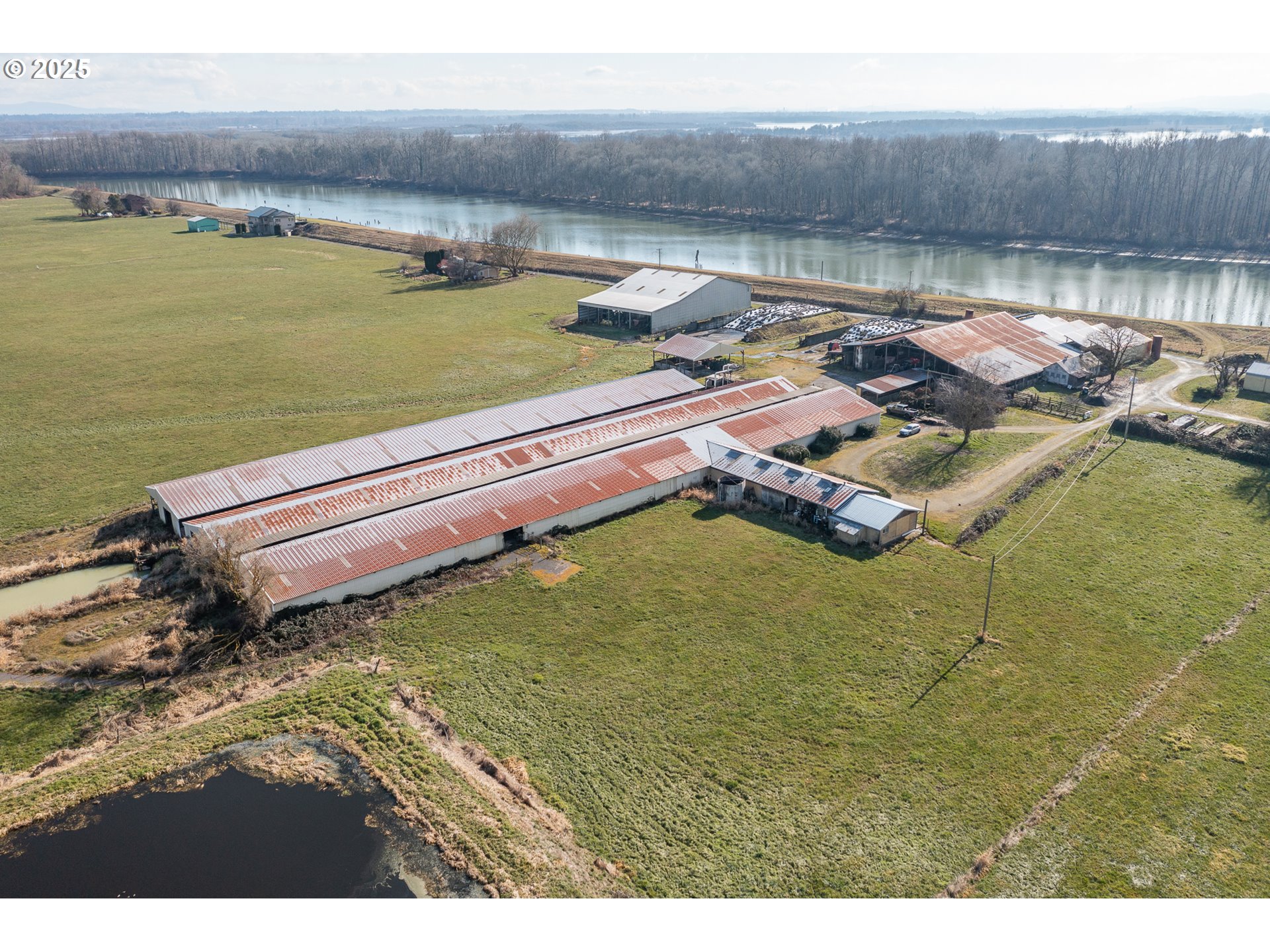 35308 Riverside Lane Scappoose, OR 97056 - Photo 8 of 48 a aerial view of a house with a lake view