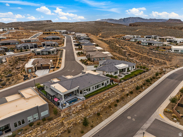 3022 West Sesia Way St. George, UT 84770 - Photo 17 of 52 Aerial perspective of suburban area featuring a mountainous background