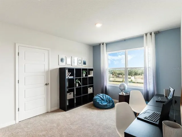 a room with furniture and window