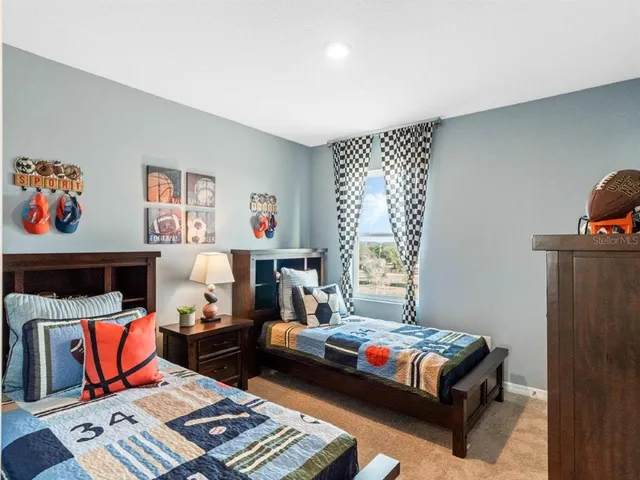 a bedroom with furniture and a window