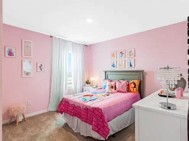 a bedroom with a bed and a mirror