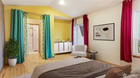 a bedroom with a bed and a large mirror with potted plants