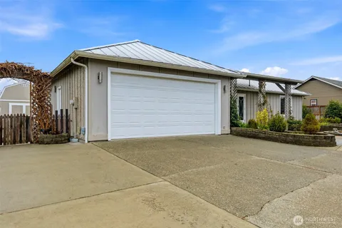a front view of a house with a garage