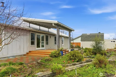 a front view of a house with garden
