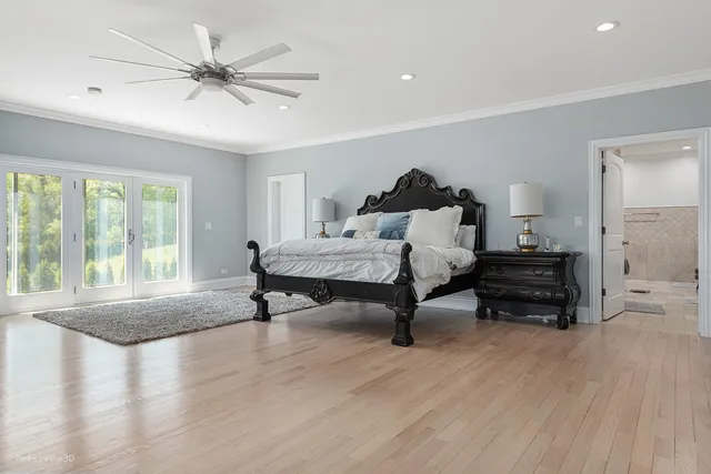 a bedroom with furniture and a wooden floor