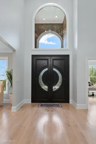a living room with a fireplace and a wooden floor