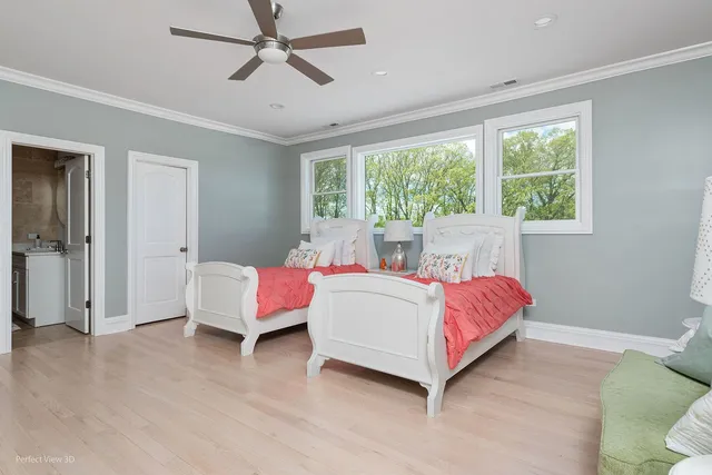 a spacious bedroom with a bed and a window