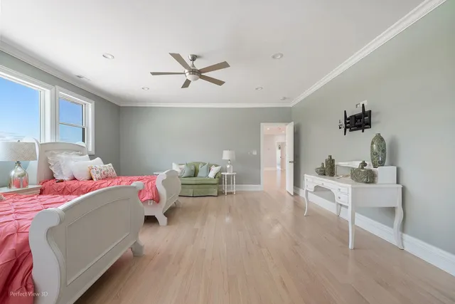 a spacious bedroom with a large bed and a flat screen tv