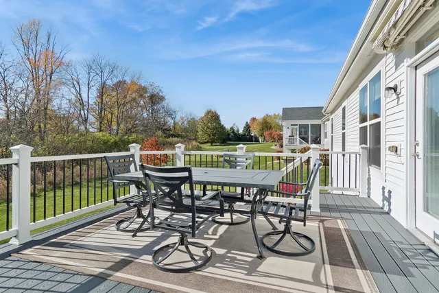 a view of a chairs and table on the wooden floor