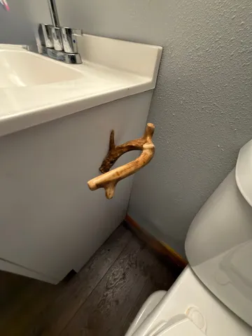 a bathroom with a sink a toilet a shower and mirror