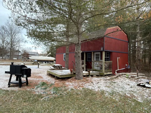 a front view of a house with sitting area